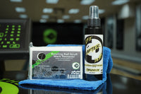 Image of a microfiber towel, TruCut Scuff Mark Remover, and 4oz of Life After Death Bowling Ball Cleaner + Life Extender on a table in a bowling alley