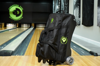 4 Ball Premium Tournament Dually Roller Bag in bowling alley